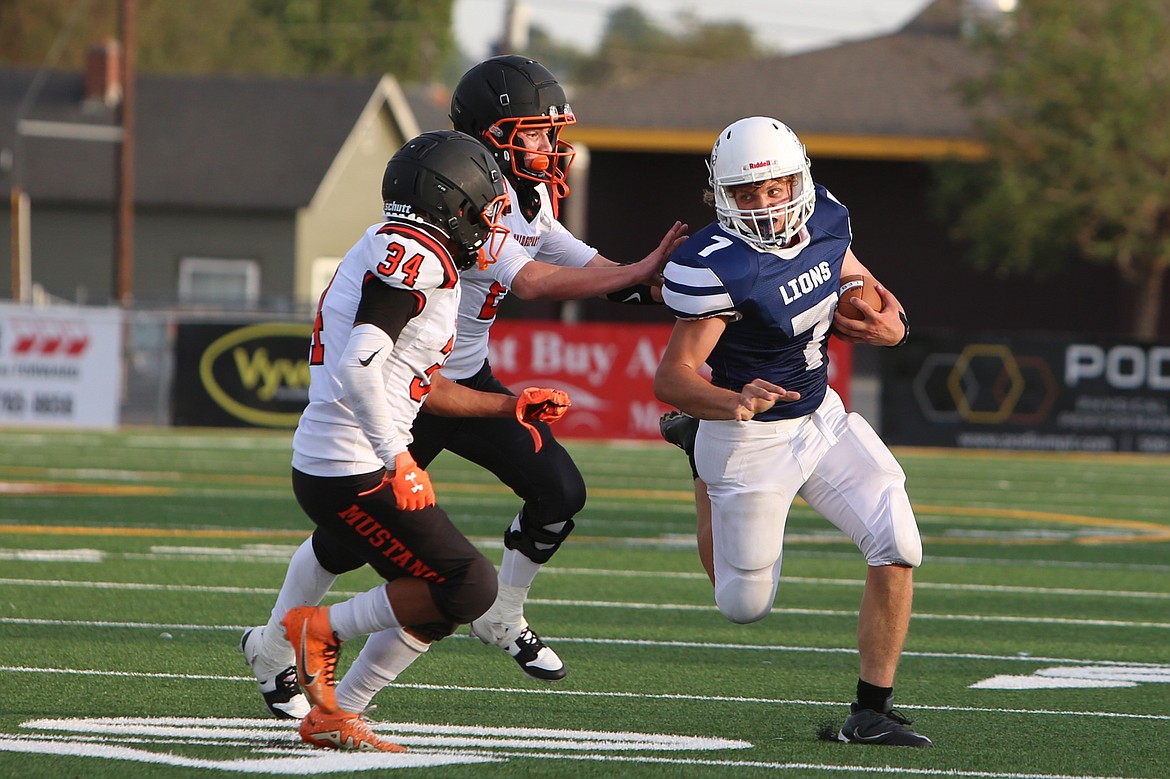 MLCA/CCS senior Rubin Ulyanchuk (7) looks to stiff-arm an incoming Bridgeport defender on Saturday.