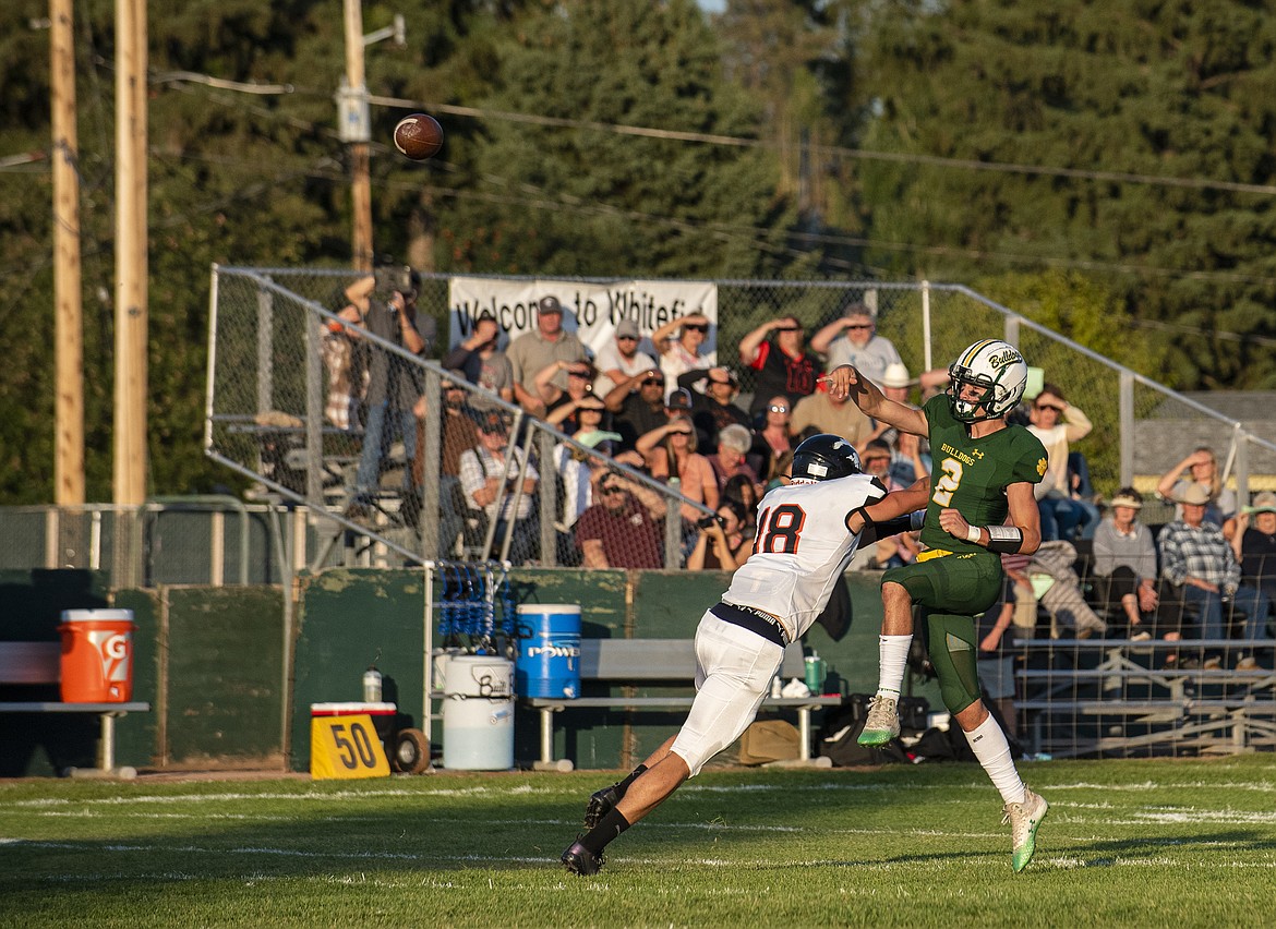 Bulldog quarterback Carson Gulick tries for a pass on Friday, Sept. 1 against Lincoln County. (Avery Howe/Hungry Horse News)