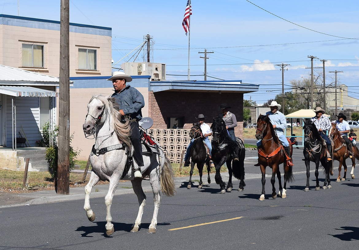 Band H2A’s dancing horses clop their way down the street during the Warden Community Days parade.