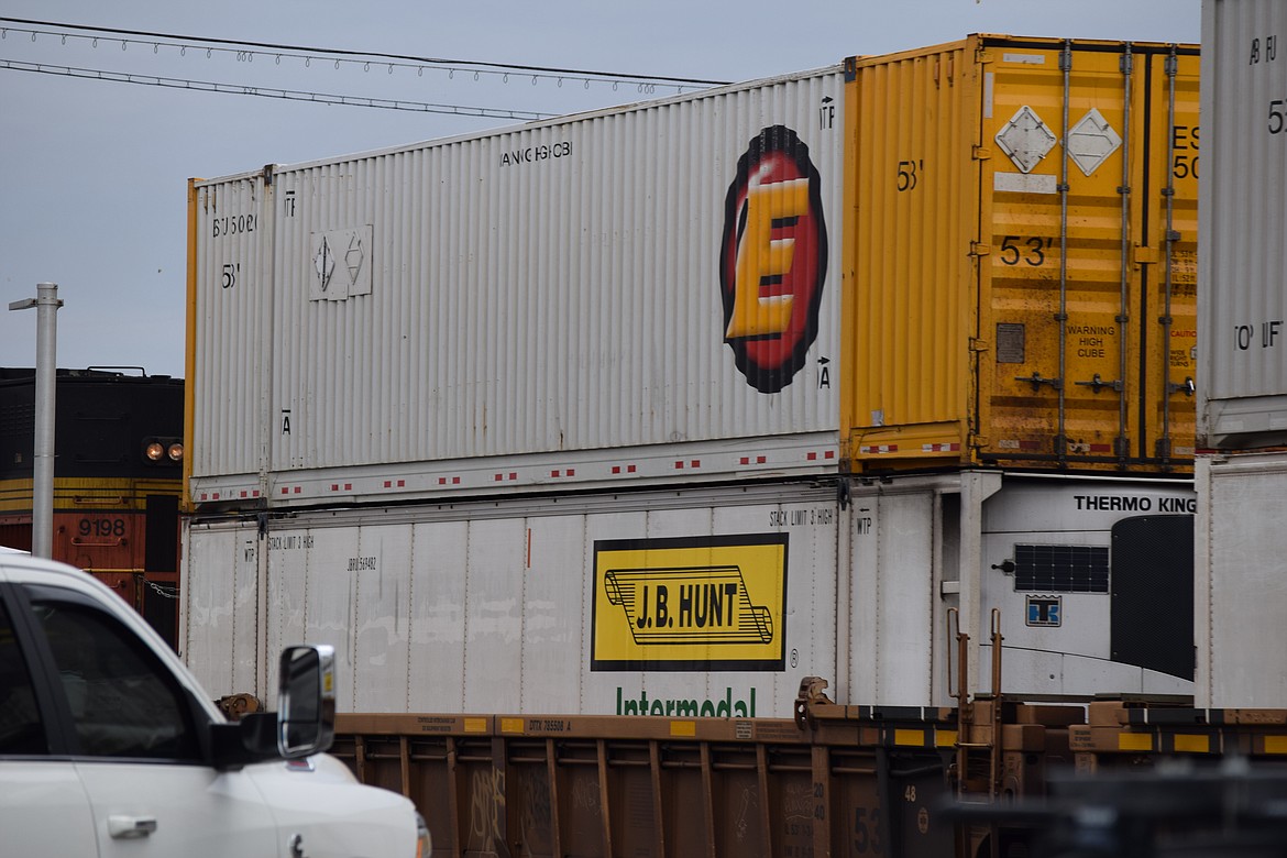 A pickup waits for a train in Grant County. Railways throughout Eastern Washington connect ports and other manufacturing centers, as well as agricultural products, to distribution centers and markets across the continent, including seaports along the Pacific coast.