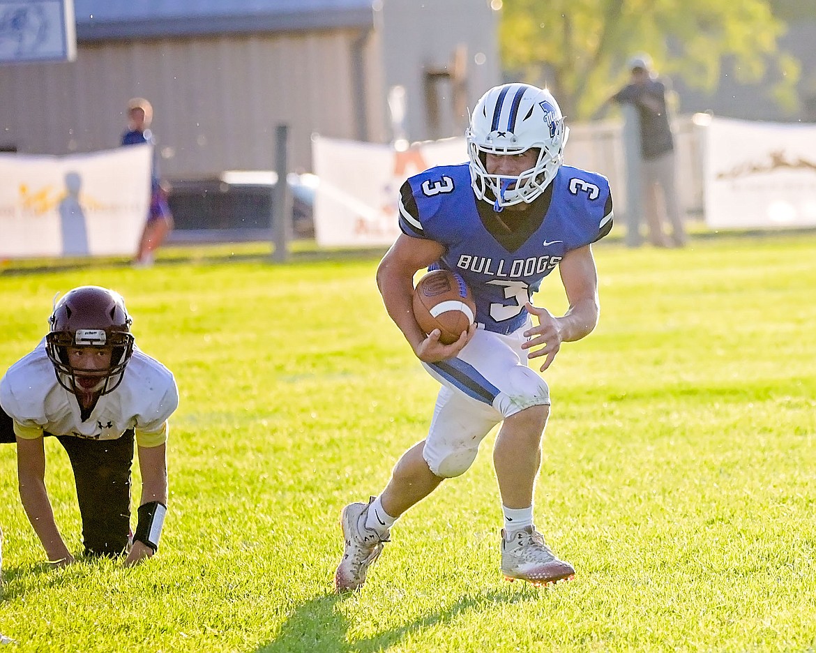 Bulldog Kelby Dumont runs the ball during the Mission-Troy game on Friday. (Photo by Christa Umphrey)