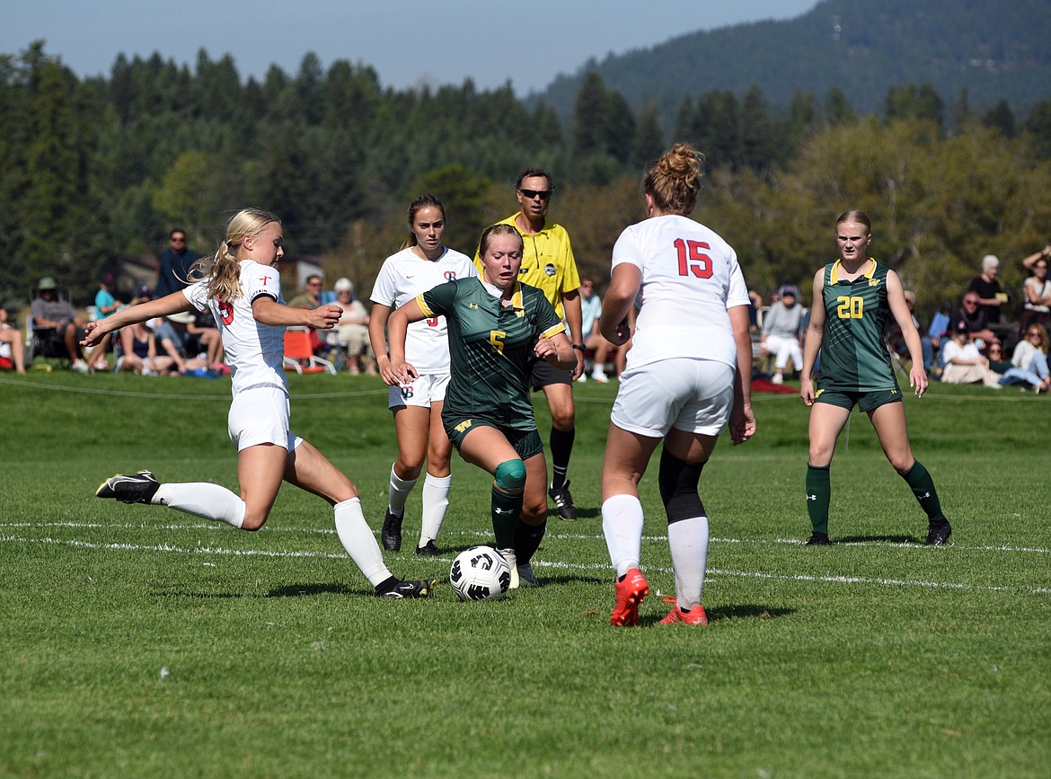 Whitefish sophomore Taylor Dorvall battles for position in a match Saturday against Loyola at Smith Fields in Whitefish. (Matt Baldwin/Whitefish Pilot)