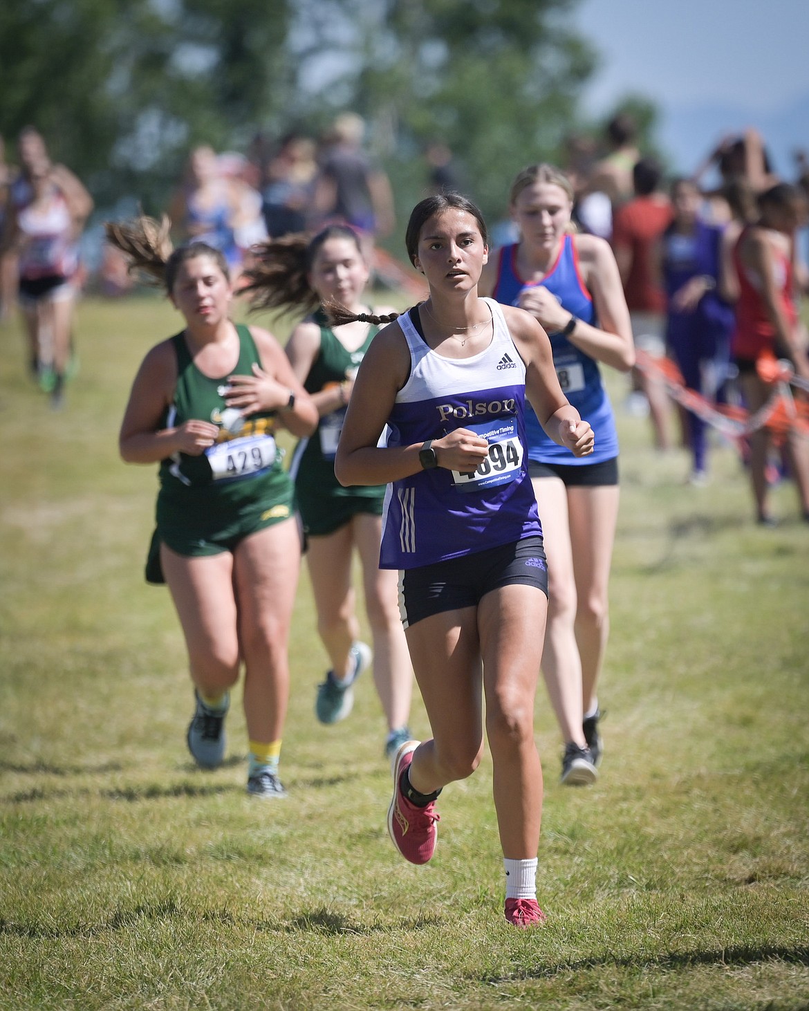 Polson's Natalie Adams pulls out in front during the Flathead Invitational in Kalispell. (Photo by Christa Umphrey)