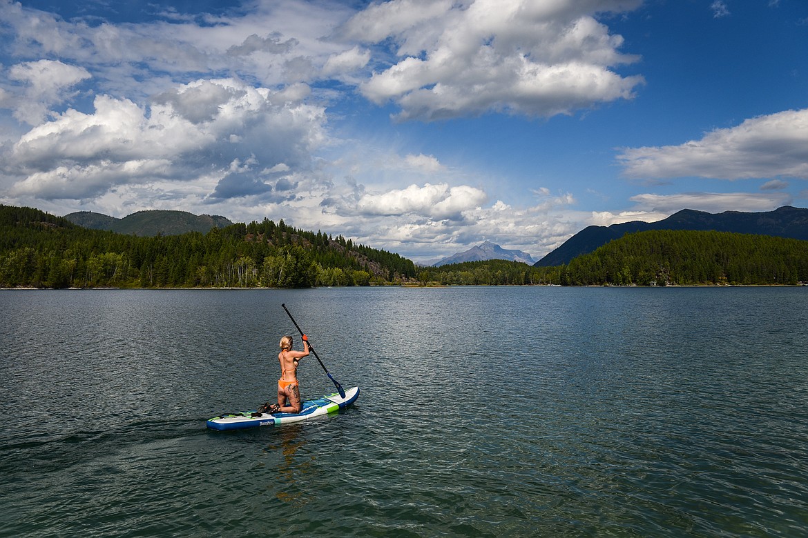 Justyna Hajduk, from Warsaw, Poland, paddles around Lake Five on Wednesday, Sept. 6. (Casey Kreider/Daily Inter Lake)