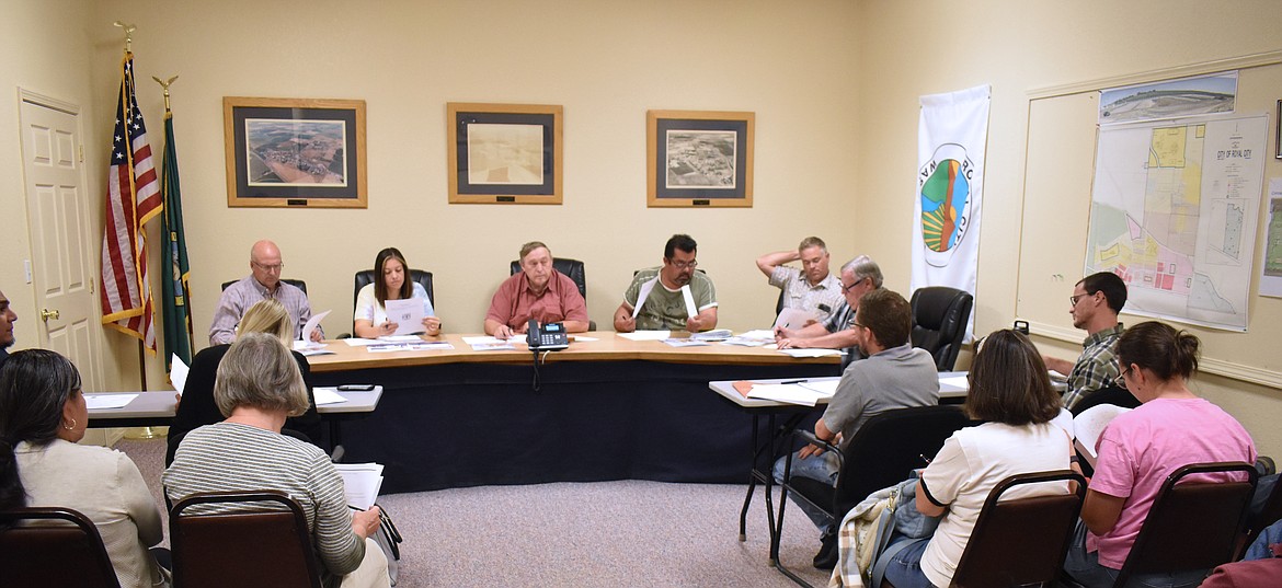 Residents filled the Royal City City Council chamber to the brim Tuesday as the council approved an agreement to get the new Royal City Library underway. From left: Council members Michael Christensen and Perla Garcia, Mayor Kent Andersen, and council members Hector Rodriguez, Ryan Piercy and Rick Kannely.