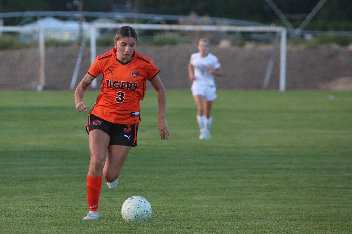 Ephrata senior Aliya Avila keeps her eyes on the ball as she moves upfield against Okanogan on Tuesday.