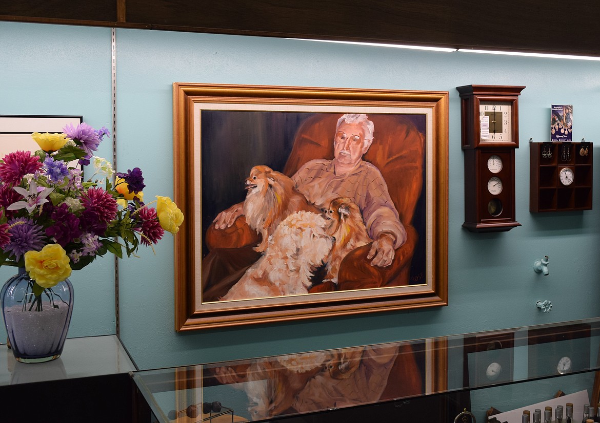 A painting of Fred Reiber hangs inside Frederick’s Jewelry. Reiber’s daughter, Marty Utsunomiya, said that it was painted by her sister.