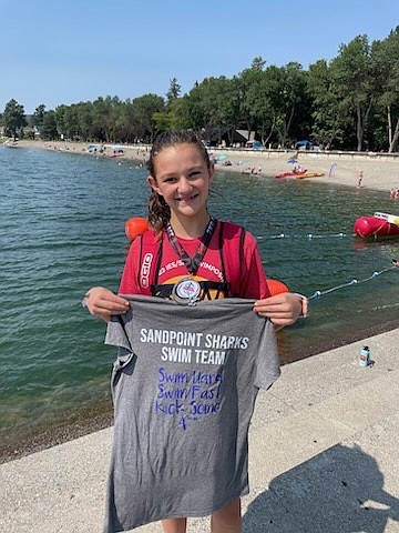 Sandpoint's Myelle Jensen poses for a photo with her silver medal from the girls 1.25k race at the 2023 Western Zone Open Water Championship meet.