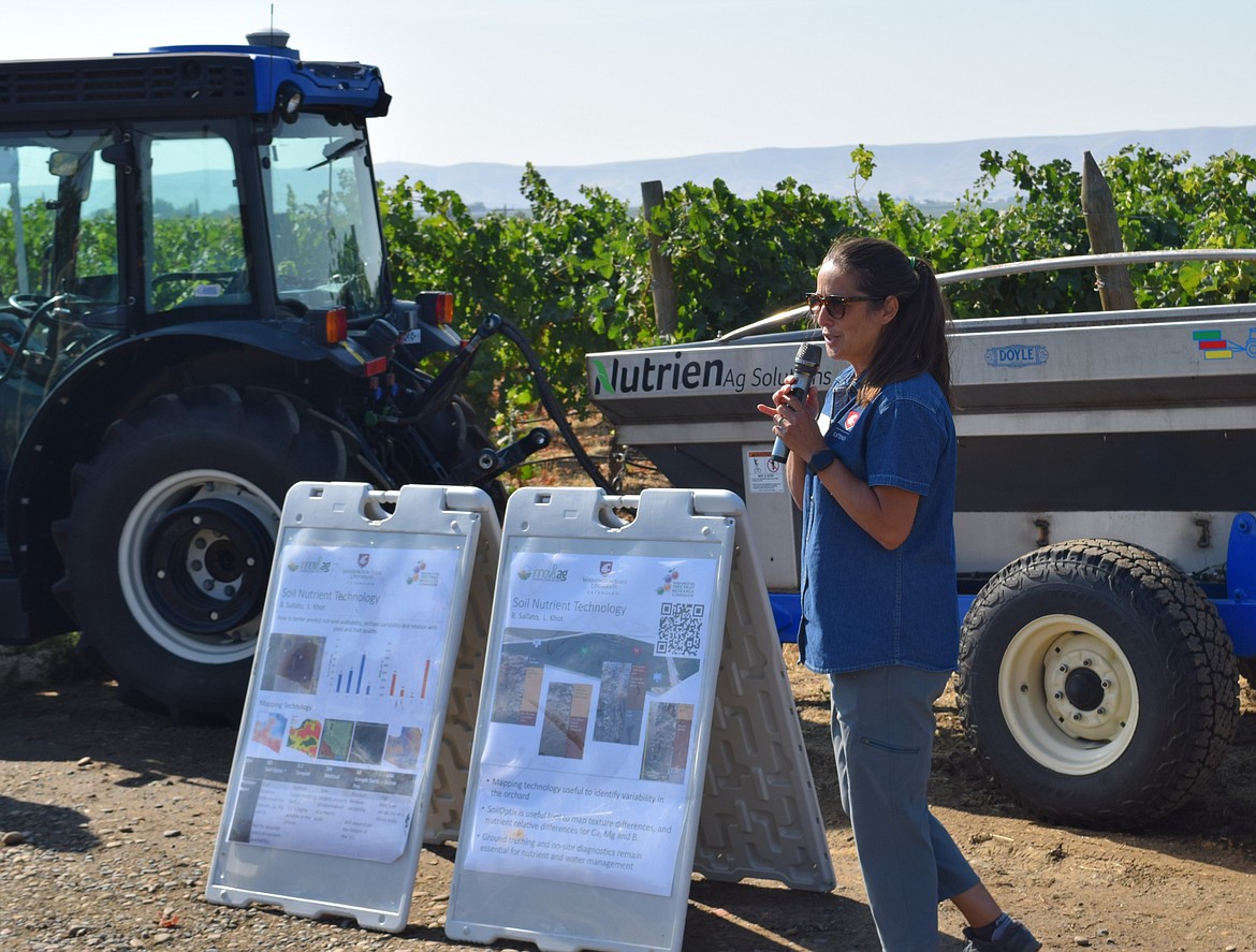 Bernardita Sallato, a tree fruit extension specialist with the WSU Prosser Irrigated Agriculture Research and Extension Center, presents on nutrient data collection at the Smart Orchard Field Day.