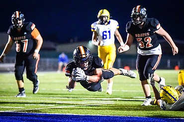 Flathead running back Jaden Williams (1) dives into the end zone for a touchdown in the fourth quarter against Missoula Big Sky at Legends Stadium on Friday, Sept. 8. (Casey Kreider/Daily Inter Lake)