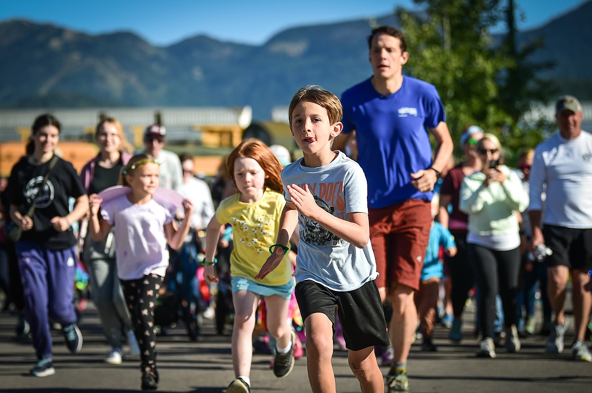 Participants take off at the start of the one mile run at the Whitefish Community Foundation's Great Fish Fun Run in Whitefish on Saturday, Sept. 9. (Casey Kreider/Daily Inter Lake)