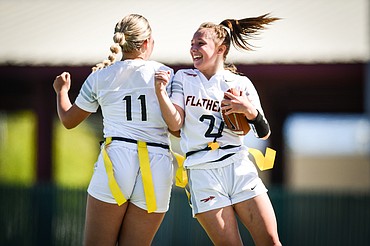 Flathead's Kenlie Roth (2) celebrates with Layla Fisher (11) after Roth intercepted a pass and returned it for a touchdown in the second half against Butte at Legends Stadium on Saturday, Sept. 9. (Casey Kreider/Daily Inter Lake)