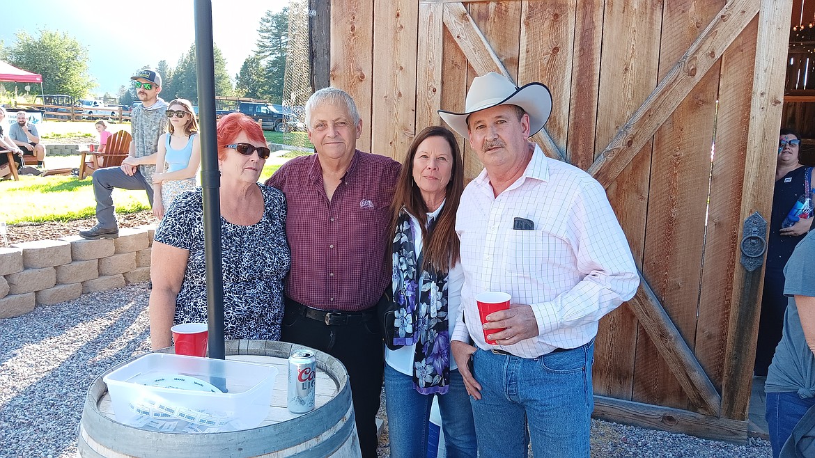 Donna Simons, Commissioner Duane Simons, Commissioner Dawn Terrill and Commissioner Roman Zylawy enjoy Freedom Fest held last weekend at Alberton Orchards celebrating the U.S. Constitution and freedom with non-partisan residents of Mineral County. (Monte Turner/Mineral Independent)