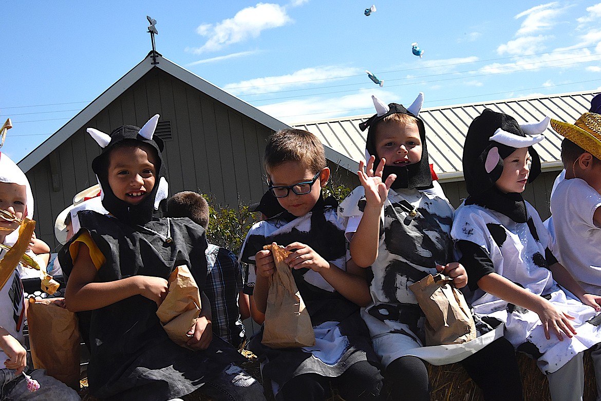 Charlo school kids can't decide whether to throw the candy or eat it. (Berl Tiskus/Leader)