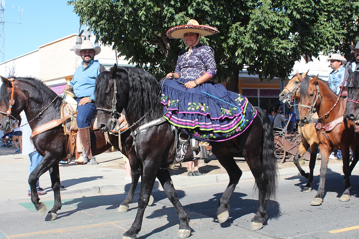 A horsewoman shows off her skills riding sidesaddle in Quincy’s Farmer Consumer Awareness Day  parade.