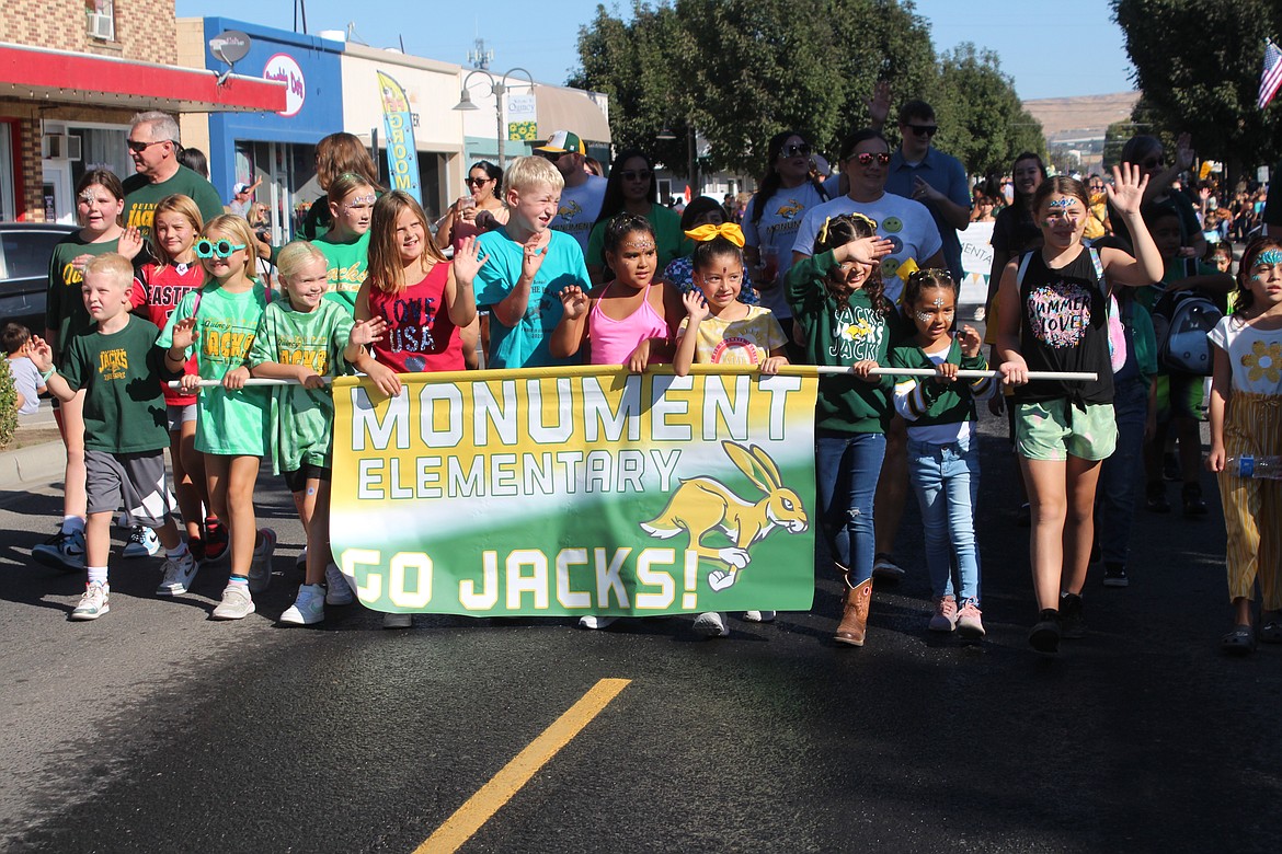 Monument Elementary students head down the street during the Farmer Consumer Awareness Day  parade Saturday.