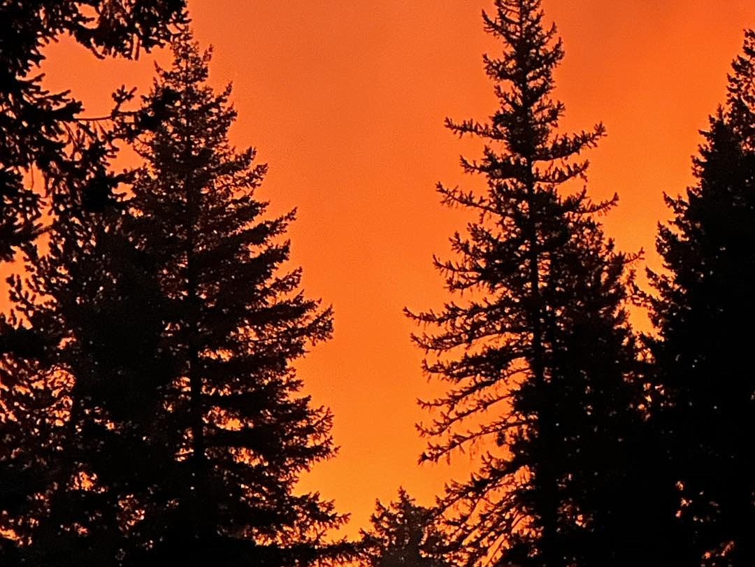 Flames turned the sky orange at the Oregon Road fire near the town of Elk north of Spokane. Moses Lake Firefighter Paramedic Rick Kelly and Probationary Firefighter Paramedic Gary Lebacken spent nine days mostly doing structure protection at the fire in August.