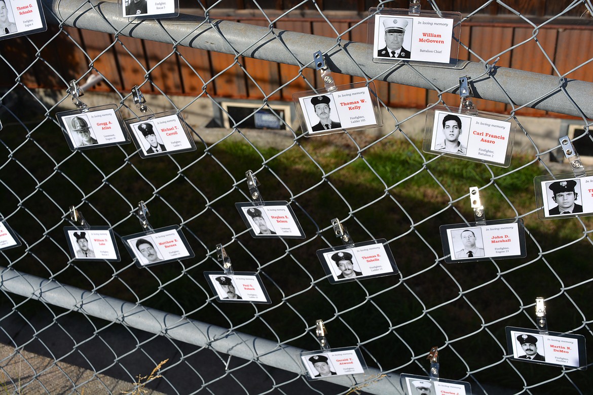 Names and stories of fallen first responders were secured to a fence leading up to the stairs used in the Wallace 9/11 stair climb memorial.