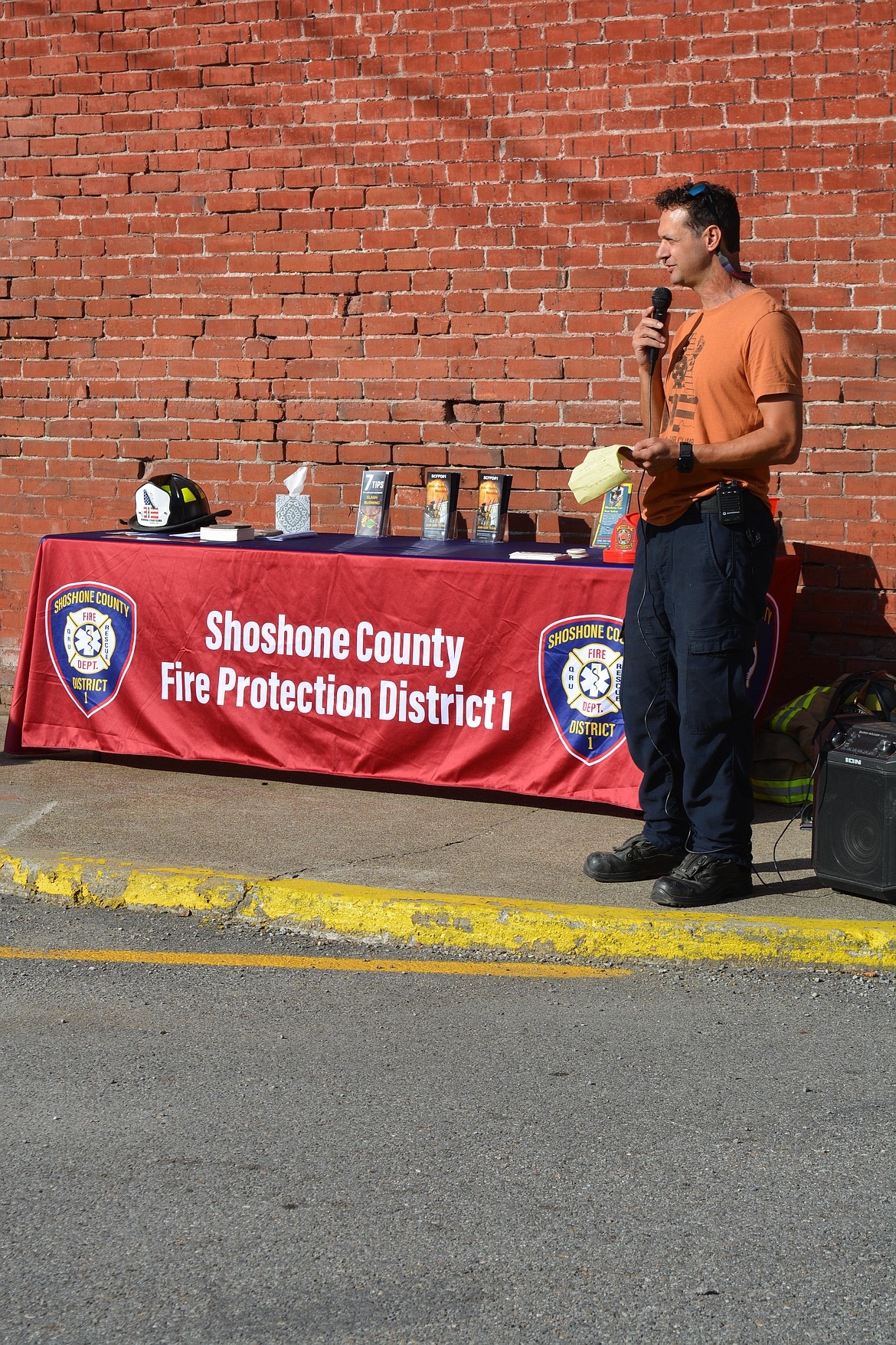 Shoshone County District One Fire Chief John Miller speaks to the participants before the 9/11 stair climb.