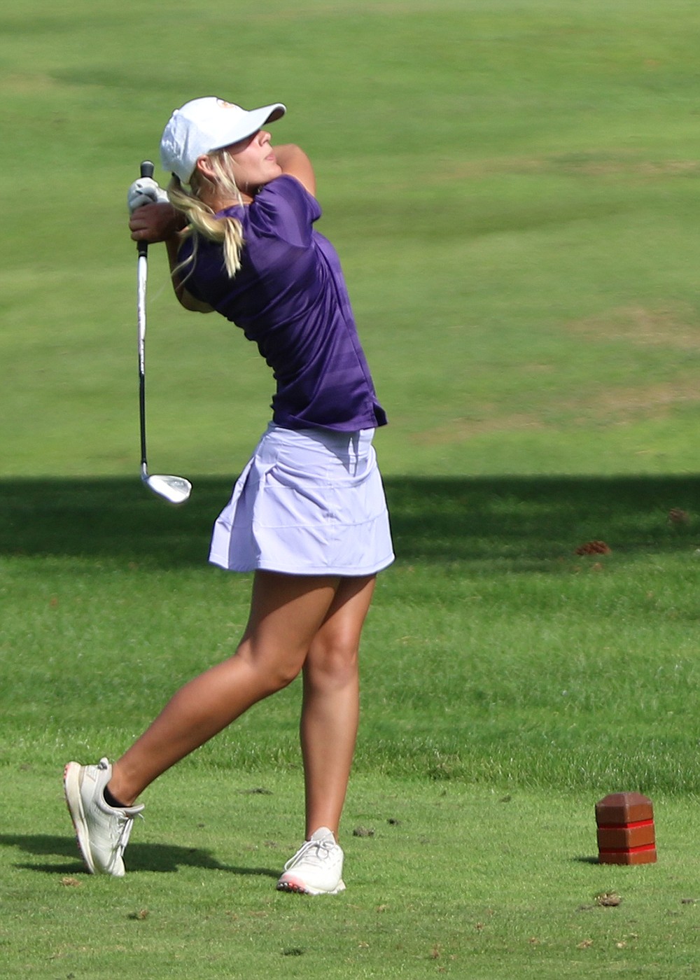 Lady Pirates' Kylee Seifer, who finished tied for fourth, tees off on last hole during Monday's home meet in Polson. (Photo by Bob Gunderson)