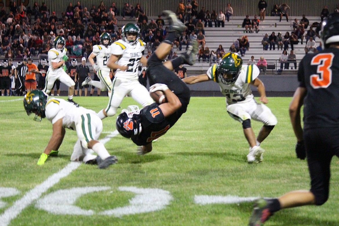 Ephrata’s Gavin Gonzalez (11) does an airborn 360 in Ephrata’s 35-12 win Friday.