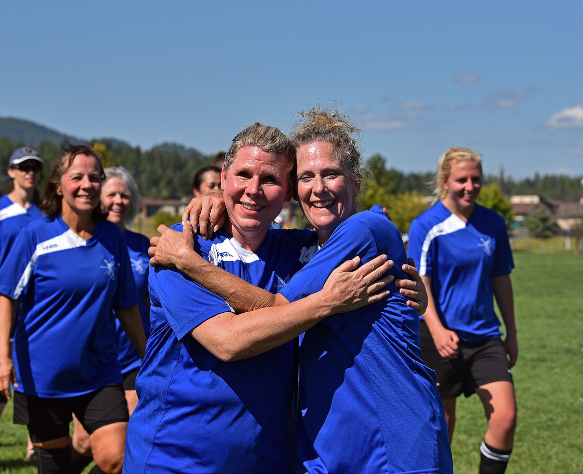 After their game, Canadian teammates embrace at the Whitefish Summer Games soccer tournament. (Julie Engler/Whitefish Pilot)