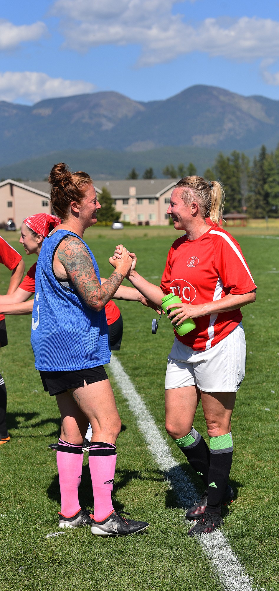 Competitors from Redfish and Bluefish share a moment after the game. (Julie Engler/Whitefish Pilot)