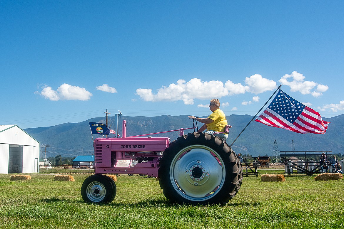 A 1948 John Deere "B" lines up for the tractor parade at the Northwest Antique Power Association’s Engine, Tractor and Threshing Bee at Olsen Pioneer Park on Sept. 10.