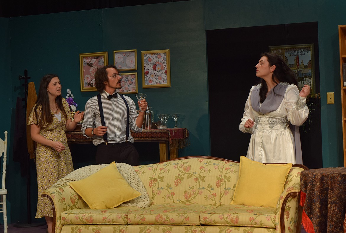 Destiny Bunney, Jeff Ames and Zhané Serrano perform onstage during a media preview night for “Blithe Spirit” Thursday, Sept. 7, while director Marla Allsopp watches from the audience seating inside Masquers Theater in Soap Lake.