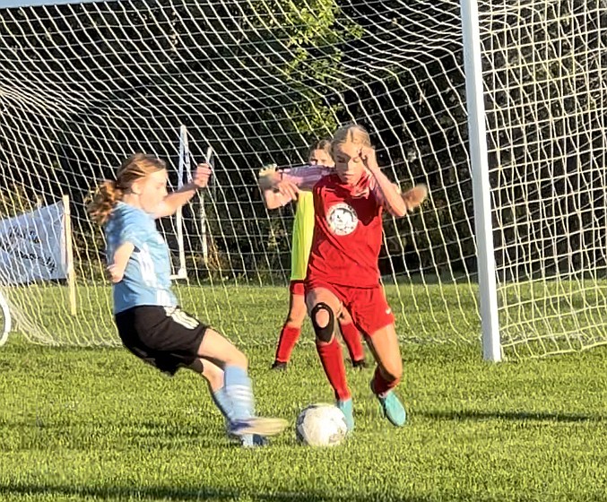 Photo by JULIE SPEELMAN
Evelyn Haycraft of the Thorns U13 girls defends during a 3-1 win over the Sounders Shadow in a Pend Oreille Cup tournament game last weekend in Sandpoint. Elle Sousley scored the first goal for the Thorns, and Kylie Lorona and Payton Brennan also scored in the win.