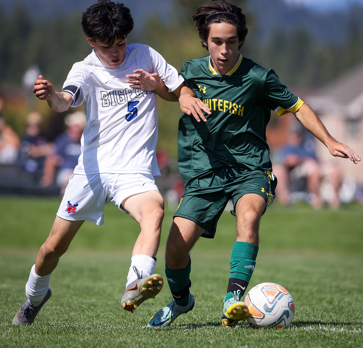 Whitefish's Ryder Elliot keeps the ball away from Bigfork's Leo Diaz during the Bulldog's 4-0 win against the Vikings Saturday. (Jeremy Weber/Bigfork Eagle)