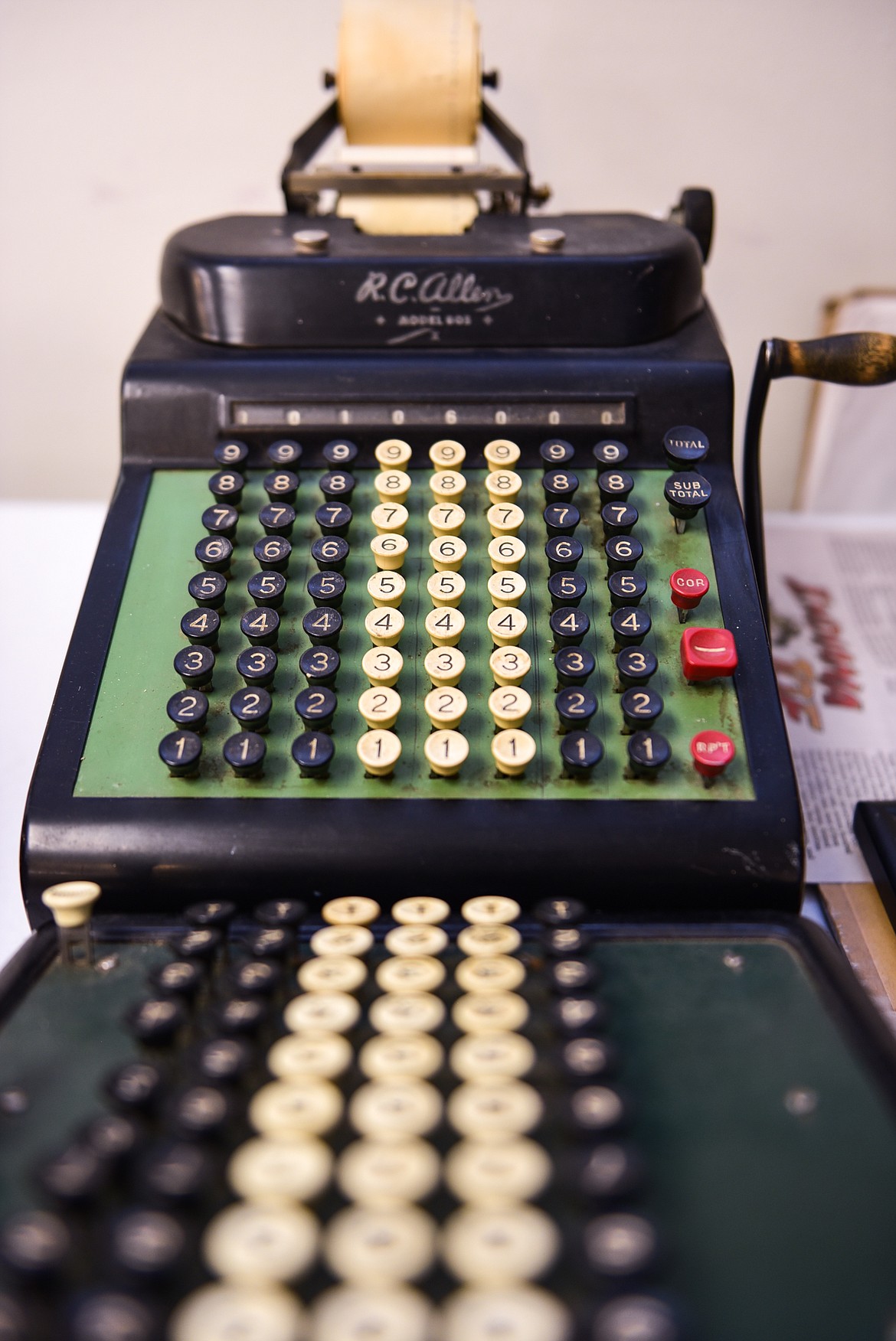 Two vintage, hand-crank Burroughs adding machines that will be for sale at the Northwest Montana History Museum's yard sale. (Casey Kreider/Daily Inter Lake)