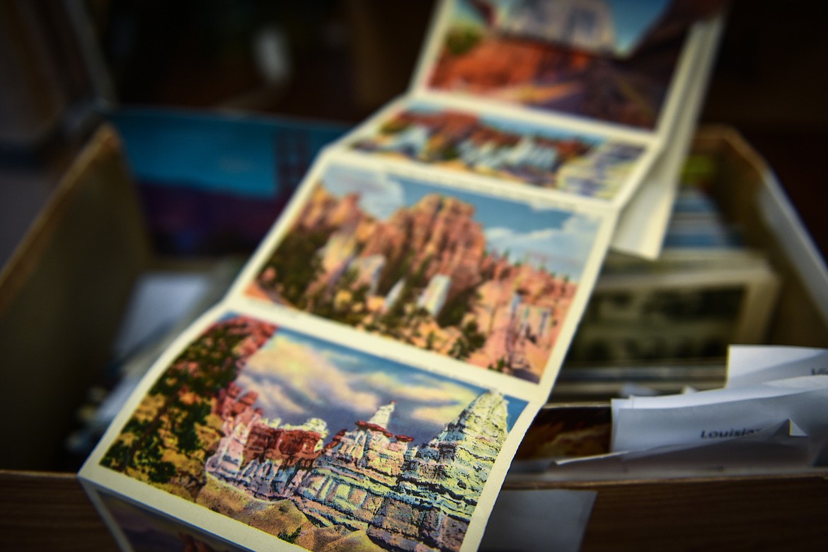 A series of illustrated postcards highlighting national parks in Utah was amongst a box of old postcards that will be up for sale at the Northwest Montana History Museum's yard sale. (Casey Kreider/Daily Inter Lake)