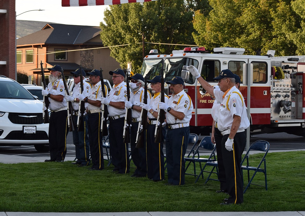 American Legion Post 28’s Honor Guard stands at attention prior to a ceremonial 21-shot salute during Monday’s ceremonies.