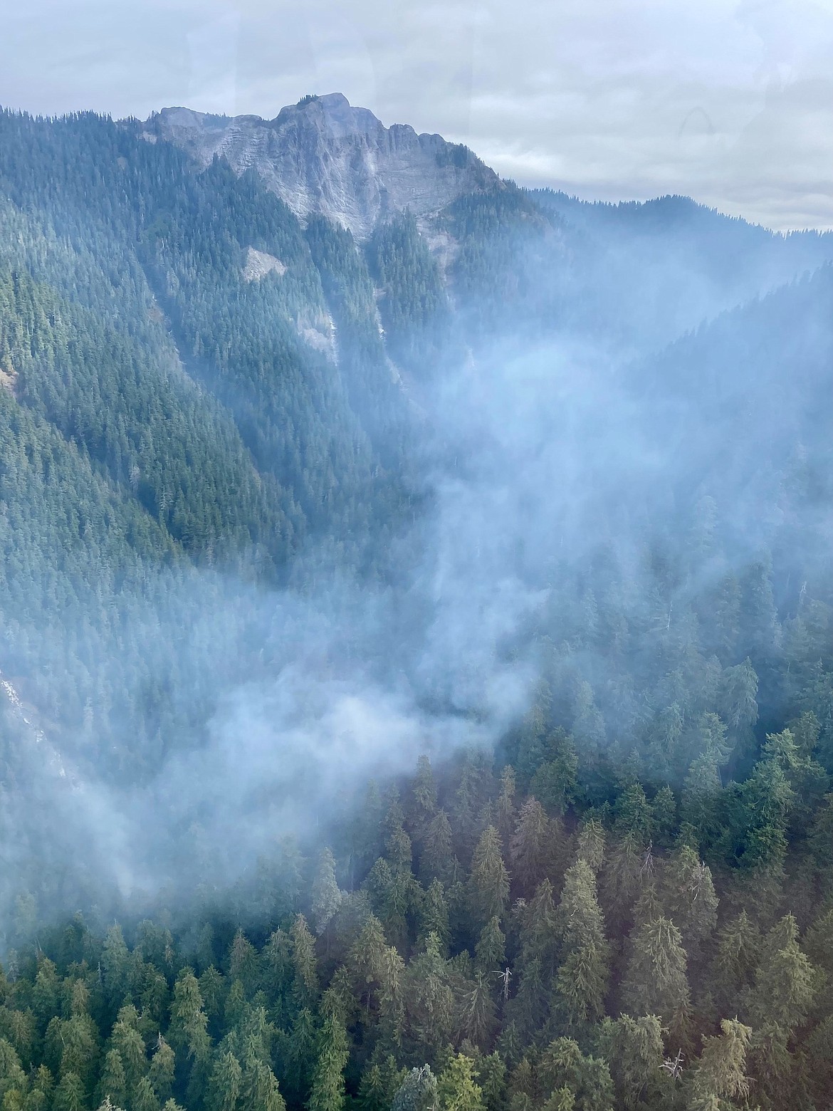 Smoke rises over the Grassy Mountain fire in the Cowlitz Complex Tuesday.