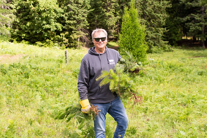 Mountain West Bank President and CEO Scott Anderson joined other volunteers from the bank to work at Kaniksu Land Trust community forest in Sandpoint.