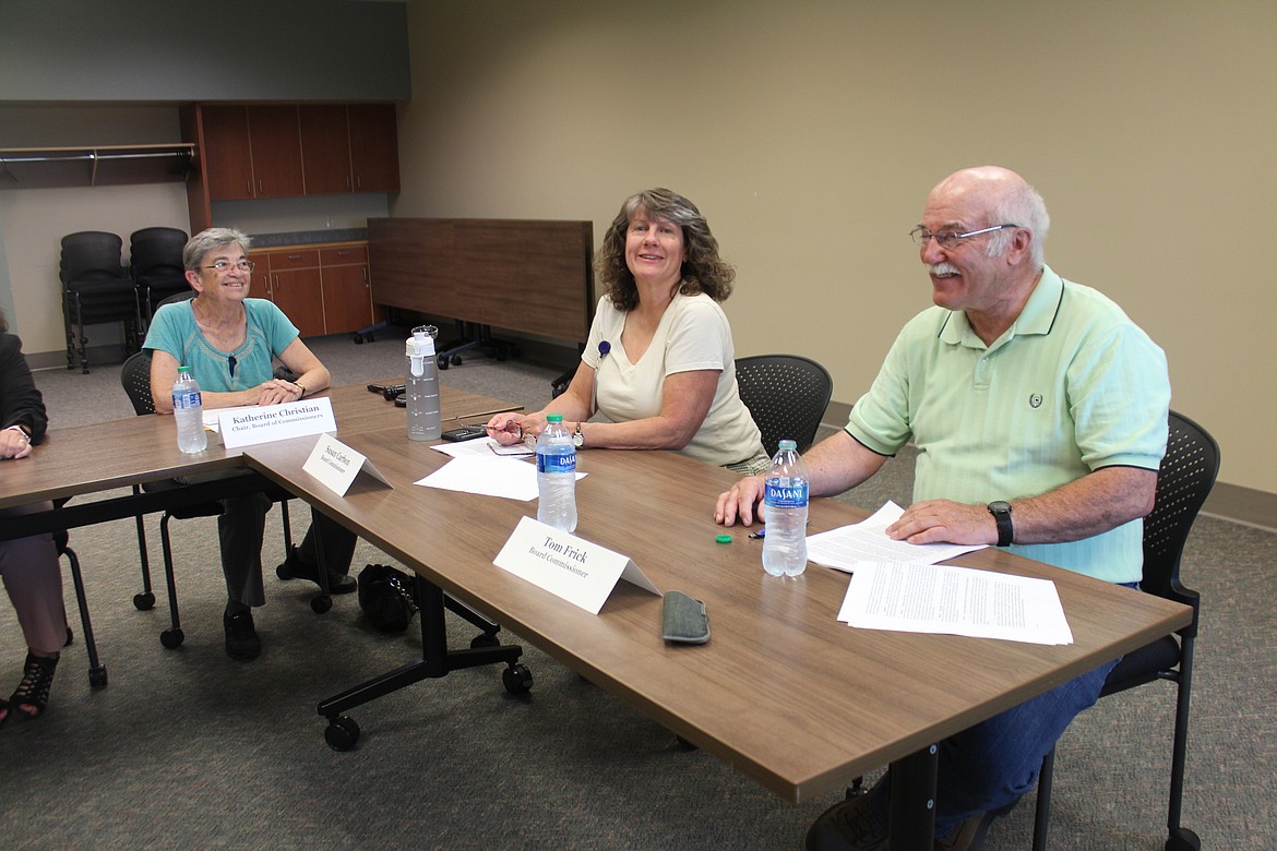 Samaritan commissioners, from left, Katherine Christian, Susan Carbon and Tom Frick discuss the issuance of construction bonds for the new Samaritan Hospital