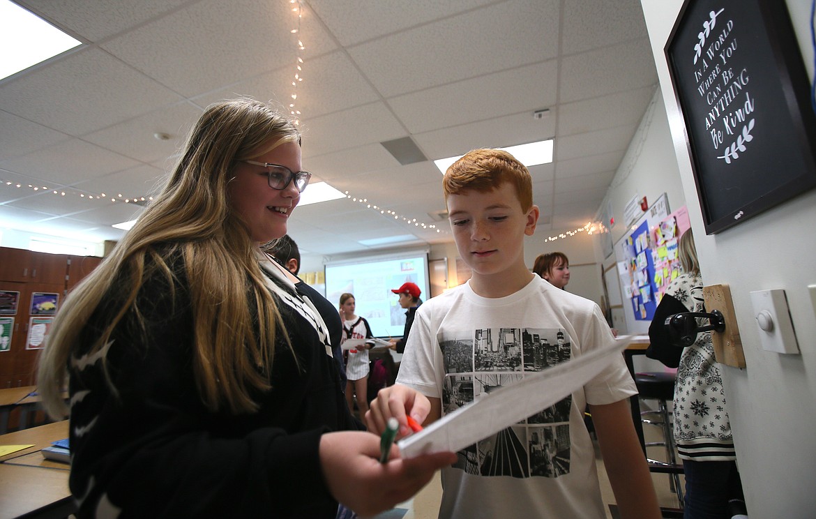 New sixth graders Dalyce Reed, left, and Hunter Bliesner work on a social studies exercise Sept. 7 in Sydney Smyly's class at Lakes Middle School.