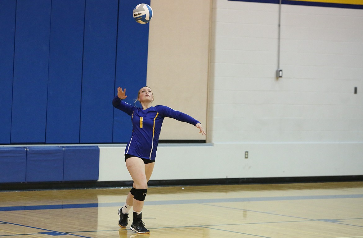 Wilson Creek junior Cassie Hinen (1) serves the ball against Moses Lake Christian Academy/Covenant Christian School on Tuesday night. Wilson Creek won the game 3-0.