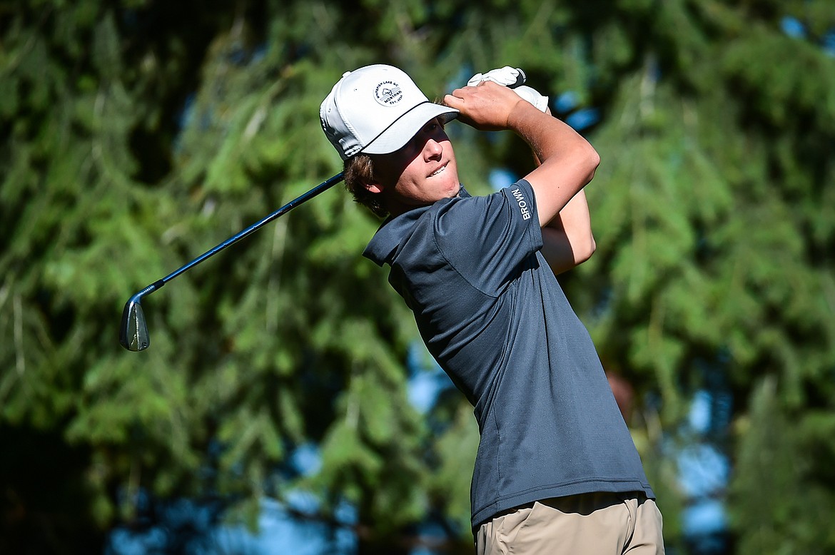 Whitefish's Riley Brown watches his tee shot on the fourth hole during the Kalispell Invite at Buffalo Hill Golf Club on Thursday, Sept. 14. (Casey Kreider/Daily Inter Lake)