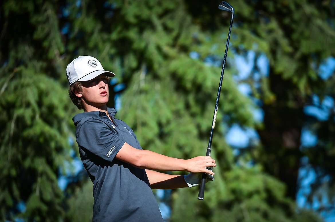 Whitefish's Riley Brown watches his tee shot on the fourth hole during the Kalispell Invite at Buffalo Hill Golf Club on Thursday, Sept. 14. (Casey Kreider/Daily Inter Lake)