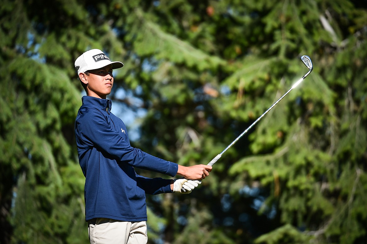 Glacier's Trevor Cunningham watches his tee shot on the fourth hole during the Kalispell Invite at Buffalo Hill Golf Club on Thursday, Sept. 14. (Casey Kreider/Daily Inter Lake)