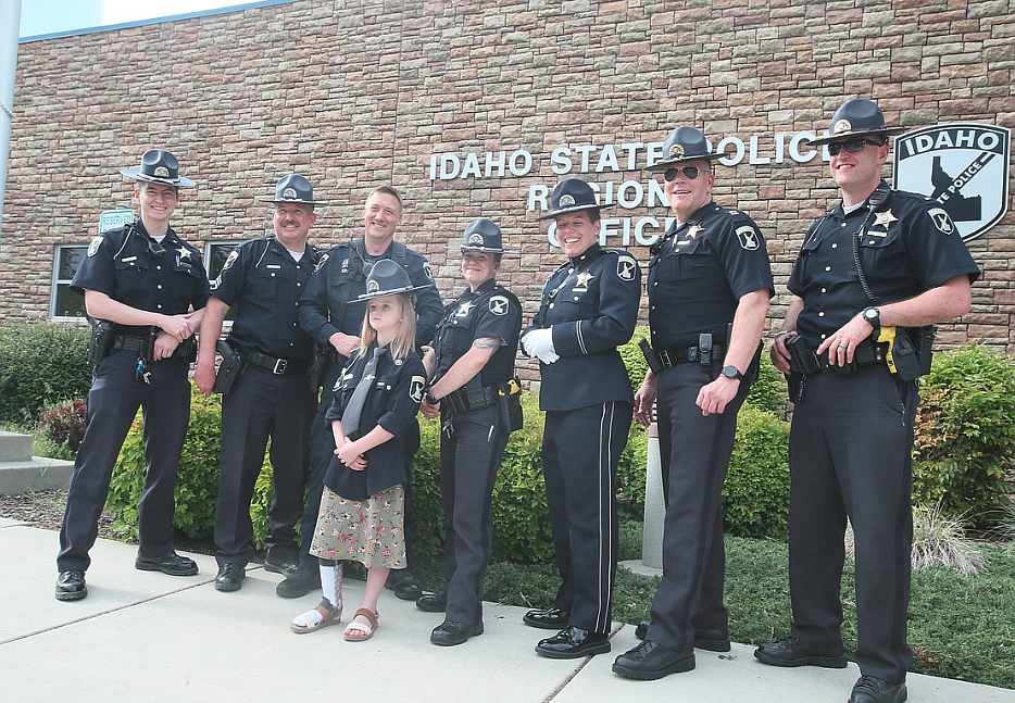 Honorary Idaho State Police Trooper Jaicey Lupton is surrounded by her ISP colleagues during a special ceremony May 31, 2022. A celebration of life for the young trooper will be at 1 p.m. Saturday at Real Life Ministries in Post Falls. Jaicey, 8, died Sept. 1 after battling an undiagnosed terminal illness for several years.