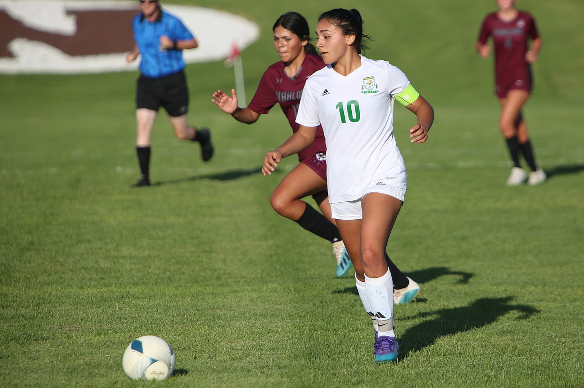 Quincy senior Michelle Acevedo pushes the ball upfield against Wahluke on Sept. 7.