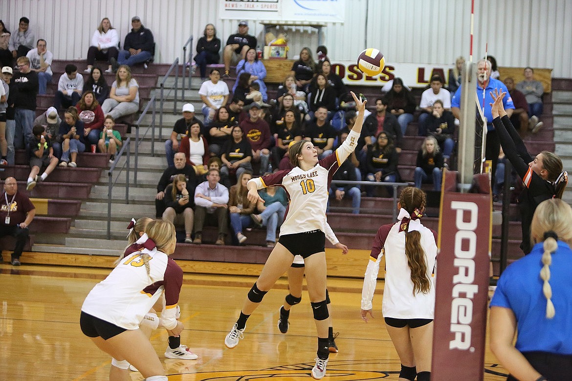 Moses Lake junior Kenna Stuart (10) tips the ball over the net in a game against Davis in the 2022 season. Stuart earned honorable mention all-league honors last season and is one of numerous Maverick returners in 2023.