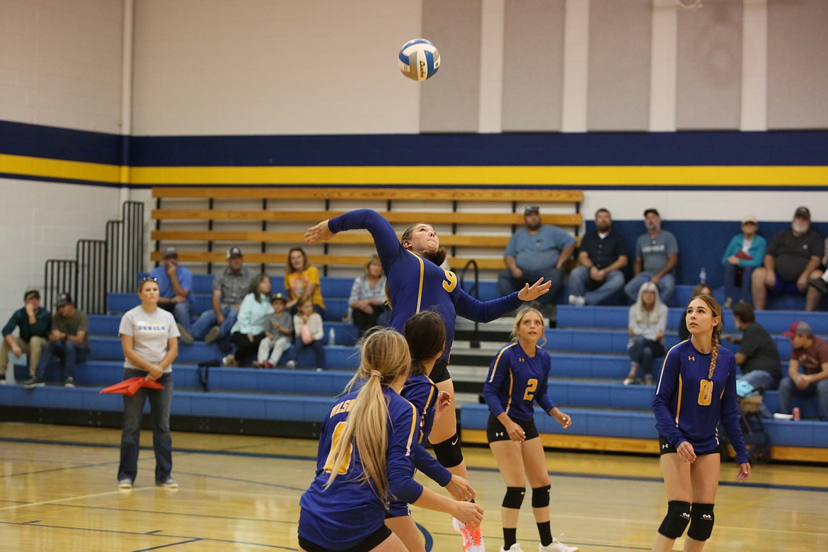 Wilson Creek junior Neeley Odorizzi leaps up to hit the ball over the net against MLCA/CCS. Odorizzi is one of six returning Devils on the court this fall, who hope to reach th 1B State Volleyball Tournament after falling short by one game last season.