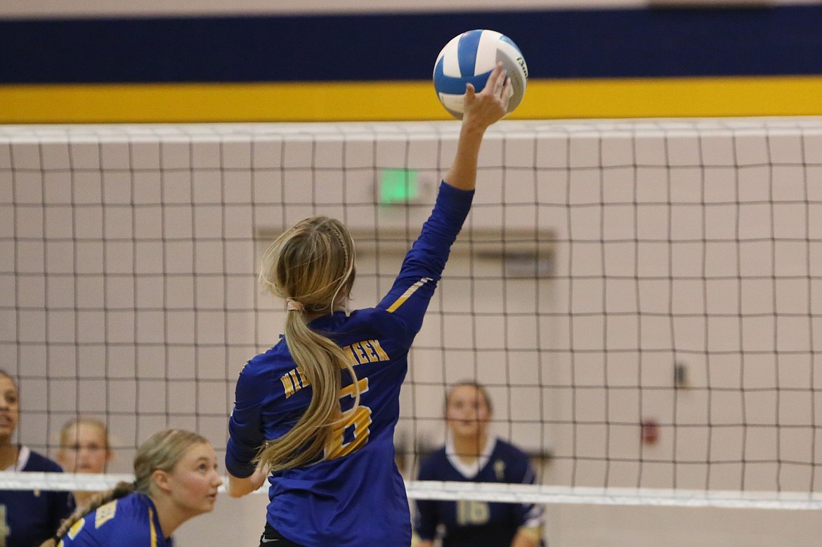 Wilson Creek senior Isabella Hochstatter hits the ball over the net during the first set against MLCA/CCS.