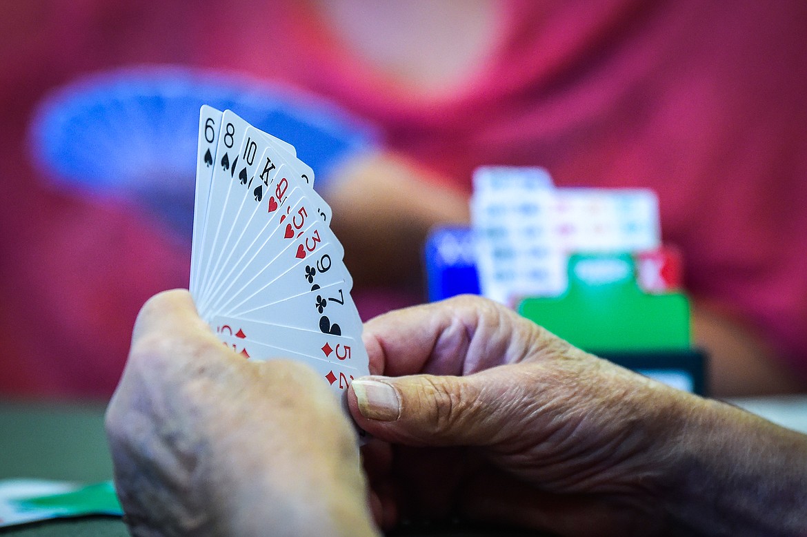 Players play a game of bridge at the Flathead Valley Bridge Center in Kalispell on Friday, Sept. 15. (Casey Kreider/Daily Inter Lake)