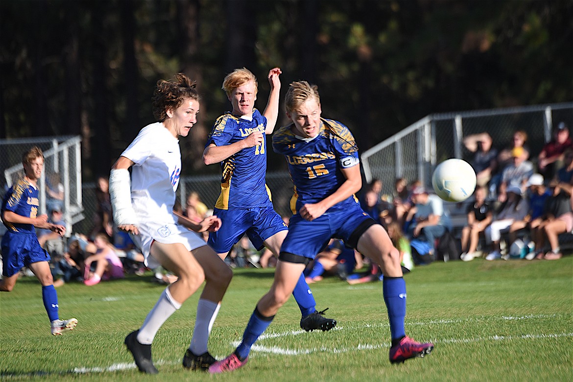 Libby's Nolan Morris (15) and Marcus Hermes (17) defend against Columbia Falls in the Sept. 14 game at J. Neils Memorial Park. (Scott Shindledecker/The Western News)