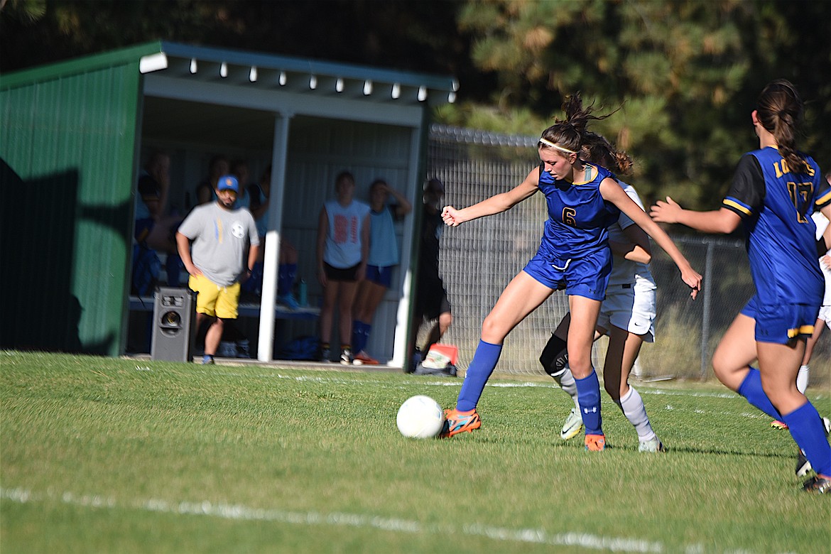Libby's Bergen Fortner (6) works to control the ball against Columbia Falls in the Sept. 14 game at J. Neils Memorial Park. (Scott Shindledecker/The Western News)